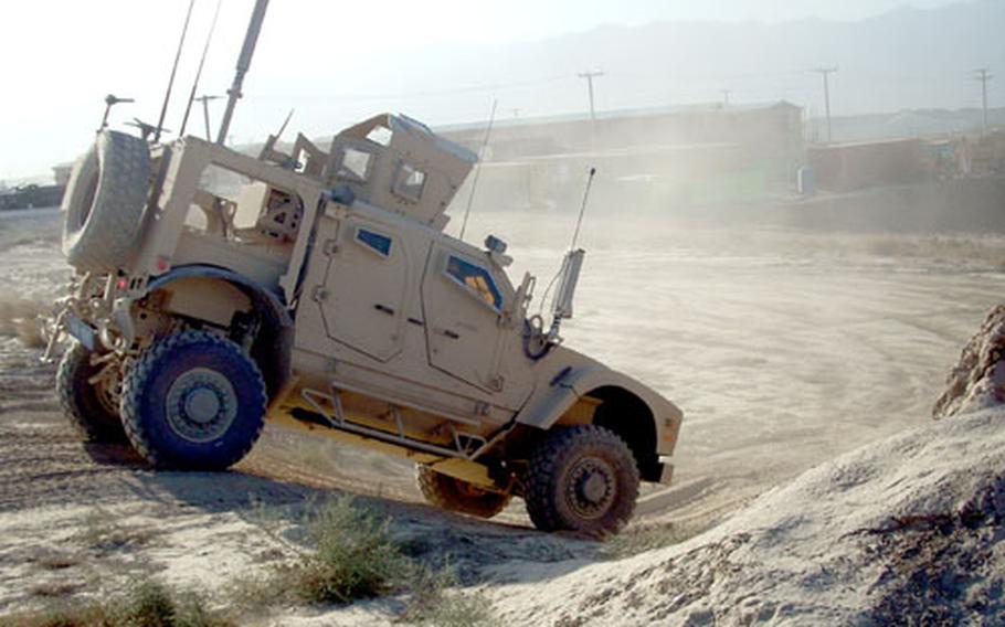 An officer test-drives the new MRAP all-terrain vehicle that is touted as a good alternative to the cumbersome Mine Resistant Ambush Protected vehicles currently being used. The new MATV is designed for easier maneuverability, but some question whether they will be as effective at saving lives.