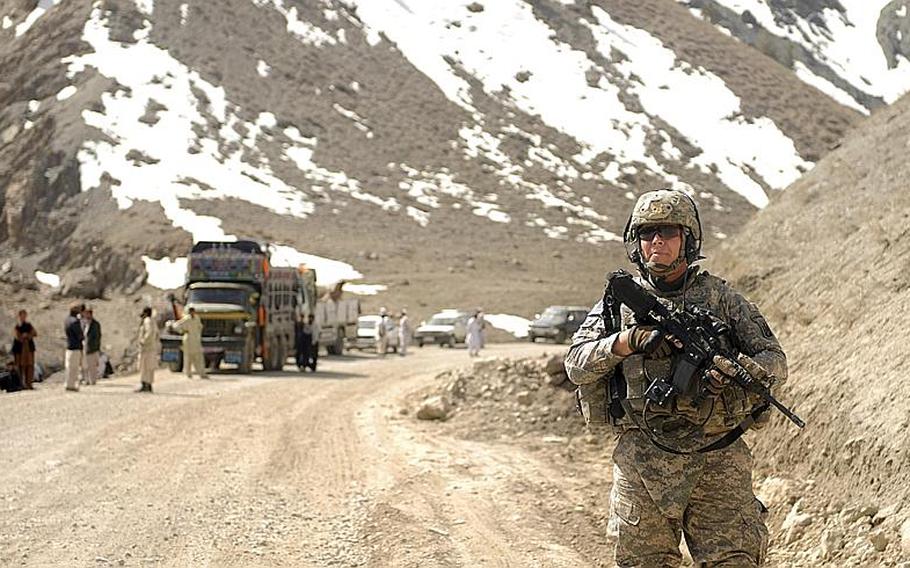 In this March 17, 2010 photo released by the U.S. Army, Army Sgt. 1st Class Thomas Snipp of Morrisville, Vt., a member of the Vermont National Guard 172nd Infantry Division, 3rd Battalion, Echo Company, Distribution Platoon, stands watch during a convoy rest stop in the Paktya province, Afghanistan. Soldiers from the Vermont National Guard company are working in the field in Afghanistan. Less than a week after arriving, soldiers from the distribution company of the Morrisville-based Echo Company are helping move supplies across eastern Afghanistan. 