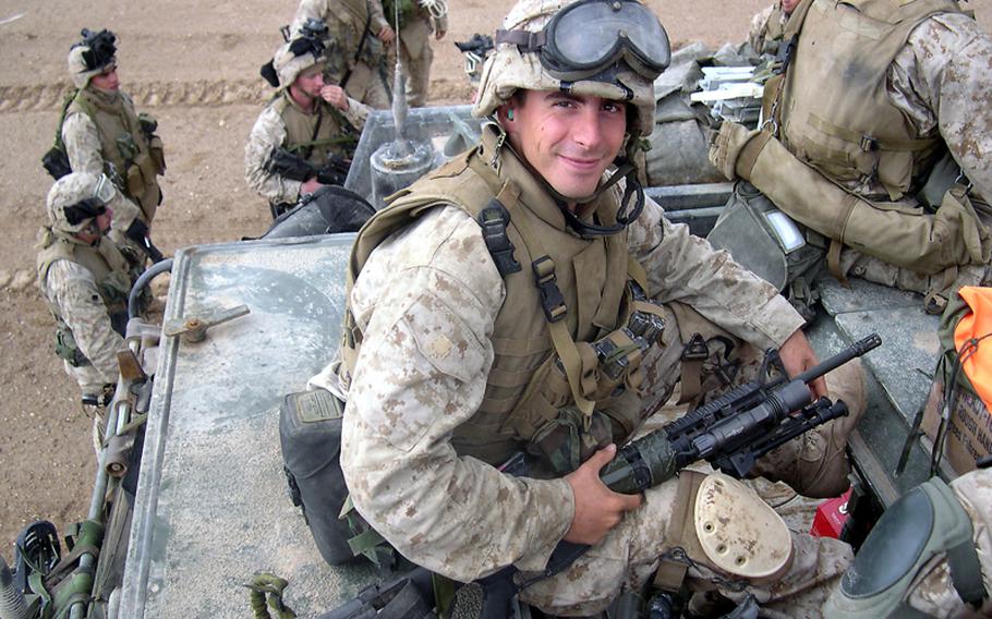 Marine Lance Cpl. Darrell Schumann in Iraq before his death in January 2005. Schumann, 25, died when the helicopter he was in crashed. Since 2008, his father has fought to get his son&#39;s name included on a war memorial in Richmond, Va. The board that oversees the memorial claims it is only for those killed in combat.