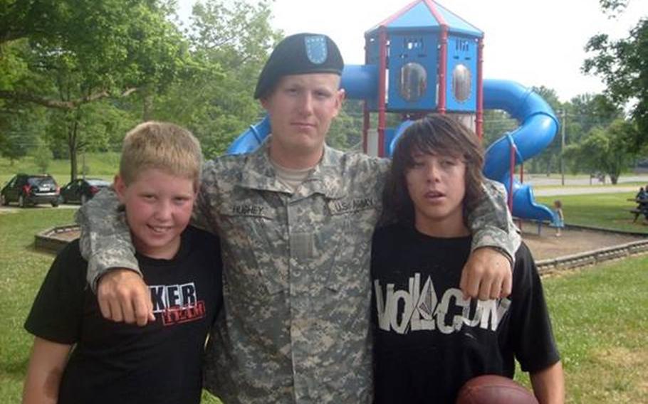 Jonathan with his two nephews after graduating from basic training. Nine of his family members traveled to Kentucky for the occasion.