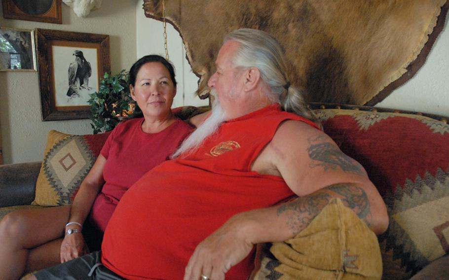 Jeanette and John Baker, sitting in their Phoenix home, have spent 2010 asking why their son, Sgt. Jonathan Hughey, killed himself on New Year's Day.