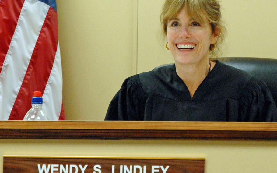 Judge Wendy Lindley smiles, laughs and gives defendants the thumbs up sign during her weekly veterans court hearings with the defendants, who have PTSD, TBI or substance abuse problems.