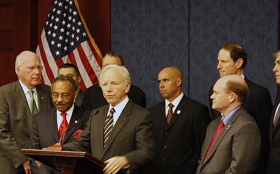 Surrounded by senators and gay rights advocates, Sen. Joe Lieberman, I-Conn., speaks to reporters at a Capitol Hill event Thursday about the chances of repeal the military's "don't ask, don't tell" law this year.