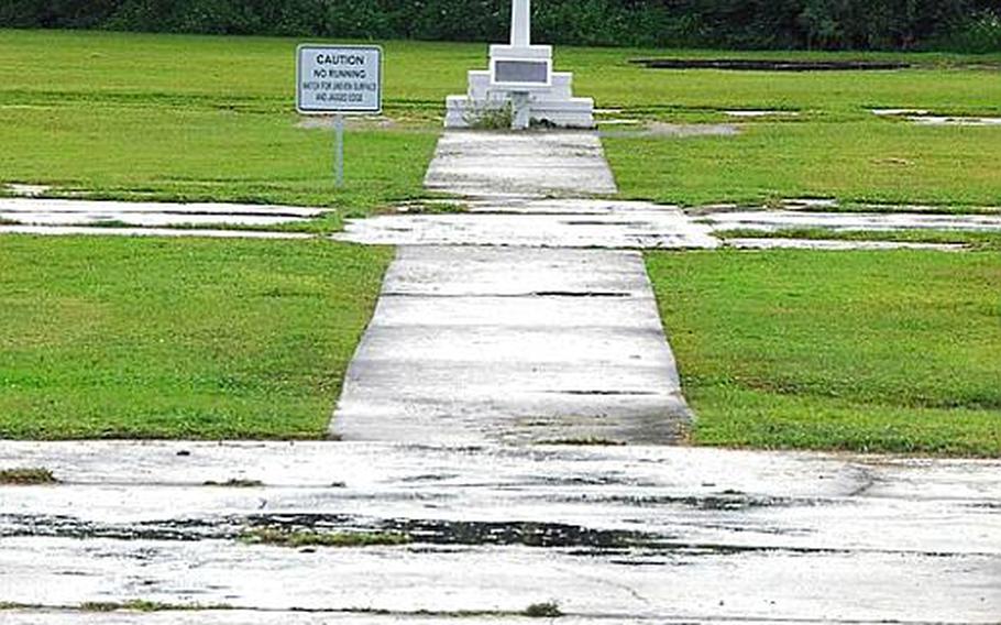 A cross marks the location of a Guam church that was destroyed during World War II. The site is now part of Naval Base Guam.