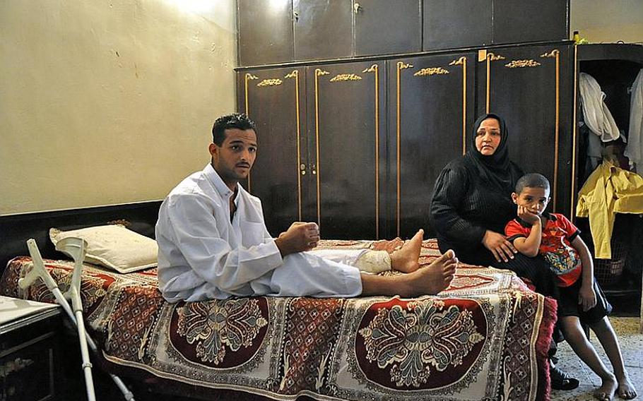 Fadel Nathem, was the equivalent of a specialist in the Iraqi army when he was wounded by a suicide car bomber in September 2008. With him in the room where he lives is his mother Yasra Abd Ali, his main caretaker, and his youngest brother.