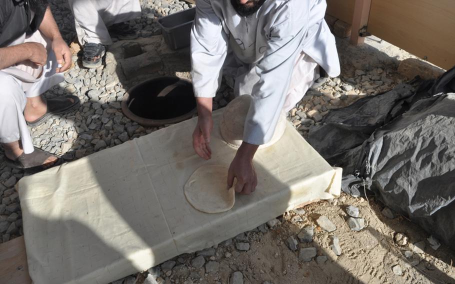 A detainee makes Afghan bread in a vocational training class in the U.S. Detention Facility in Parwan on Nov. 24. Rules of the prison prohibit photographs showing faces or identities of the detainees.