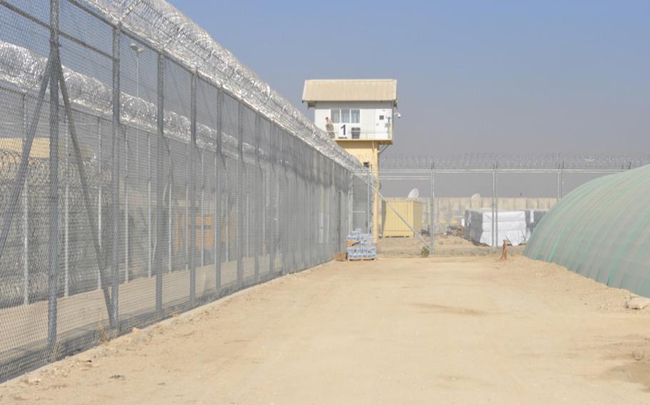 Guard towers and razor wire surround the U.S. detention facility in Parwan, where more than 1,300 detainees are held. The detainees have review hearings, but do not have lawyers and cannot challenge their detention.