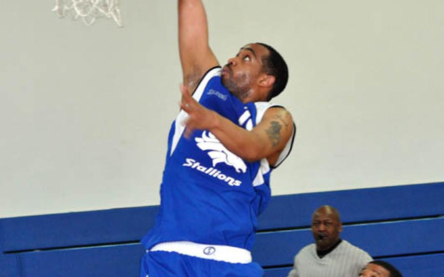 Frank Price of the Stuttgart Stallions scores with a layup aganst the K-Town Panthers during the championship game of the U.S. Forces Community Level Basketball Championship tournament at Patch Fitness Center in Stuttgart, Germany.