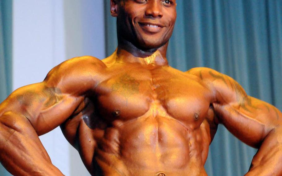 Men's overall and middleweight champion and Best Poser award winner Shannon Haynes in Sunday's 5th Pacific Muscle Classic bodybuilding, fitness and figure competition at Keystone Theater, Kadena Air Base, Okinawa.