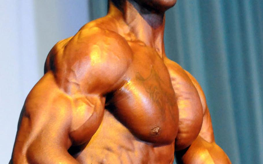 Men's bantamweight champion Marcus Caudle in Sunday's 5th Pacific Muscle Classic bodybuilding, fitness and figure competition at Keystone Theater, Kadena Air Base, Okinawa.
