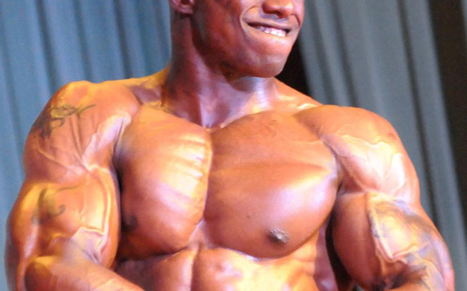 Men's light-heavyweight champion Kenneth Walker in Sunday's 5th Pacific Muscle Classic bodybuilding, fitness and figure competition at Keystone Theater, Kadena Air Base, Okinawa.
