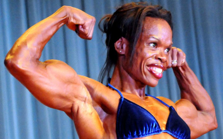 'Women's heavyweight and overall champion and Best Poser award winner Tamara Dickey in Sunday's 5th Pacific Muscle Classic bodybuilding, fitness and figure competition at Keystone Theater, Kadena Air Base, Okinawa.