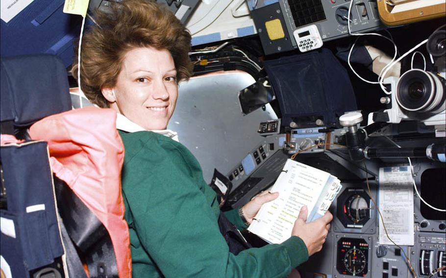 Eileen Collins, commander on 1999 ''return to flight,'' goes through a checklist in zero gravity.