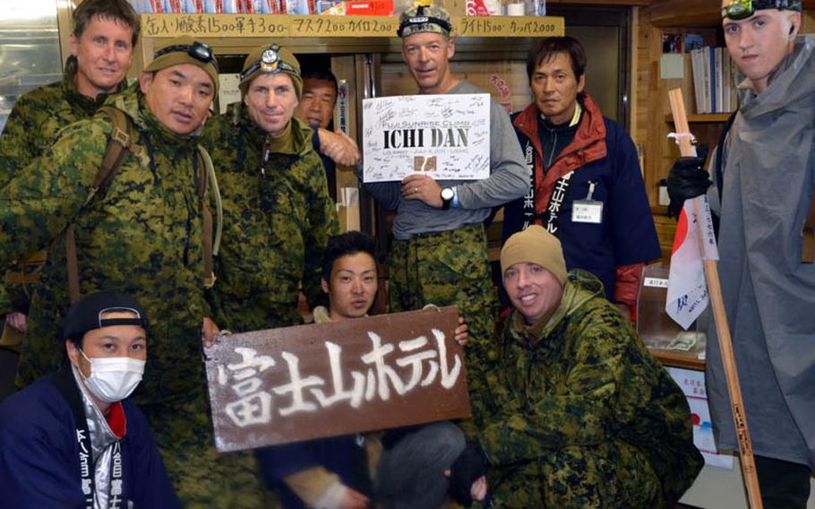 Members of the climbing group take a break in one of the rest areas on the way to the top of Mount Fuji.