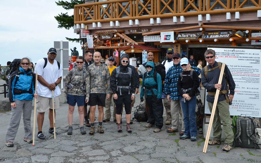 Members of American 300, a non-profit group that works with the U.S. military, two world-class climbers and dozens of U.S. troops took on the challenge of climbing Mount Fuji despite challenging weather. Members of the group pose here at the start of their journey.