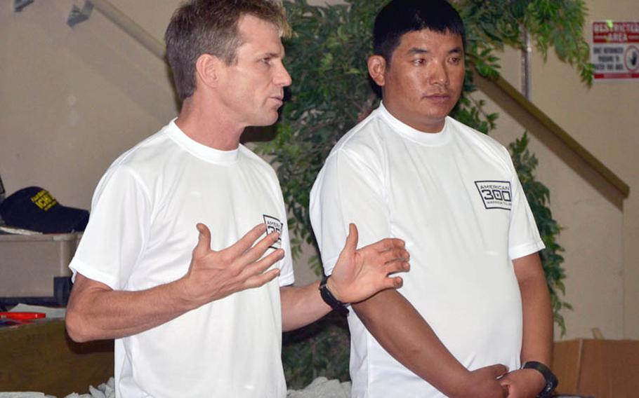 Eric Meyer, a doctor who specializes in high-altitude medicine, and Sherpa Chhiring Dorje, a world record holding Mount Everest climber, speak with the Marines at Camp Fuji about their experiences climbing the Himalayas.