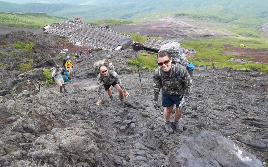 U.S. troops and members of American 300, a non-profit group that works with the U.S. military, start their climb up Mount Fuji. Weather conditions quickly changed, however, forcing most of the participants to turn around before reaching the summit.