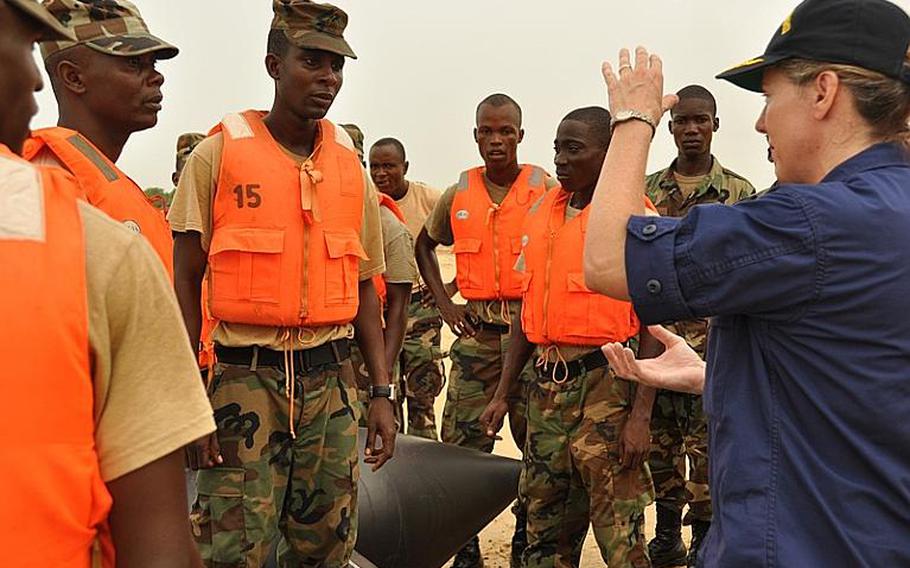 Cmdr. Jennifer Ketchum instructs recruits of the new Liberian National Coast Guard in 2010. The entire Ketchum family is now on active duty in the U.S. military.