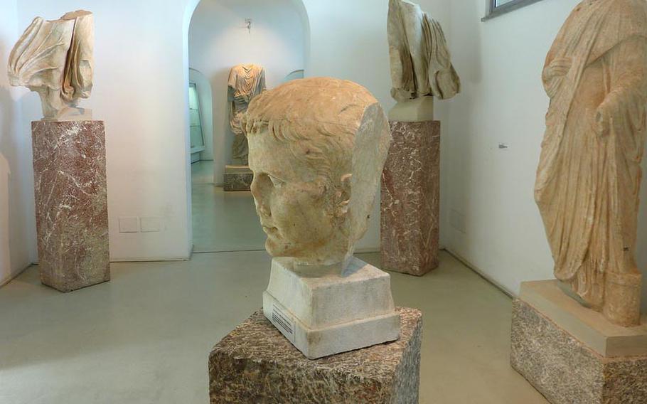 The finds of the archaeological site of Tyndaris, including a stone head of Augustus, at center, are housed in a small museum on the site.