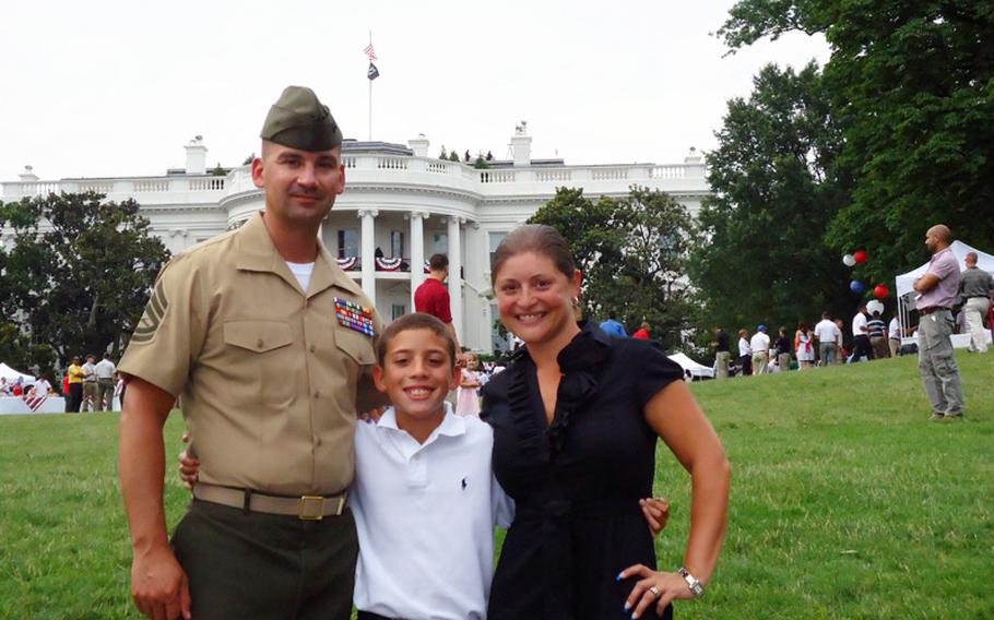 Gunnery Sgt. Felix Rivera with his son, Christian, and his wife, Sandra, at a White House event for caregivers of wounded servicemembers this summer. Felix has traumatic brain injury and post-traumatic stress disorder from getting blown up in Afghanistan in 2009. It took the last two and half years for the family to find their footing again.