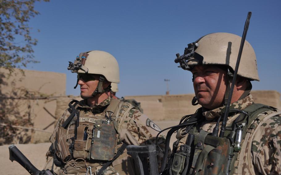Capt. Marcel Boehnert, left, commander of Germany's 2nd Infantry Company, Task Force Kunduz, stands with Master Sgt. Andreas Kaitschik, leader of Platoon B, during a patrol in western Kunduz province, Afghanistan, in October.