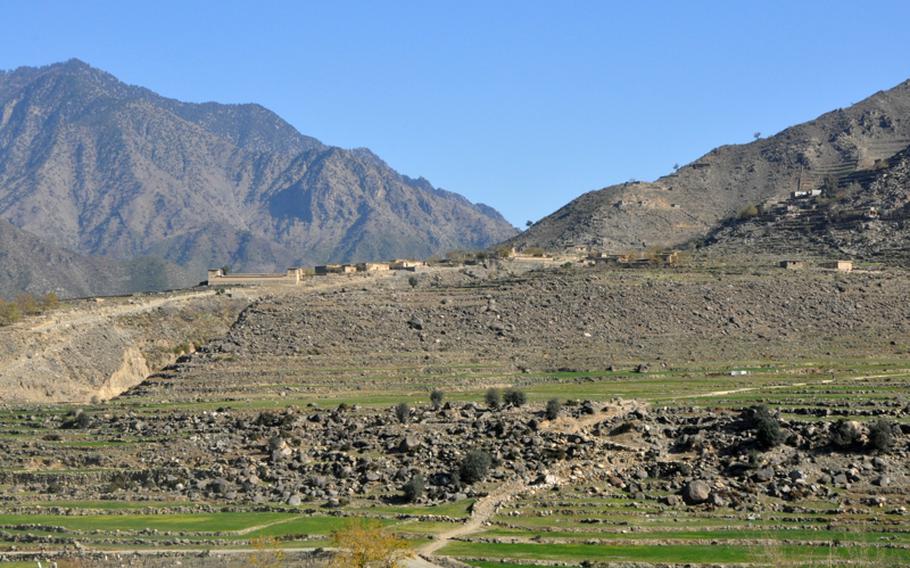 The village of Nishigam in the Kunar River Valley is five miles from Pakistan, which lies beyond the mountains in this photo. On Dec. 9, a 12-year-old Pakistani boy who had slipped over the border detonated a suicide bomb outside the village mosque, killing six people, including the police chief.