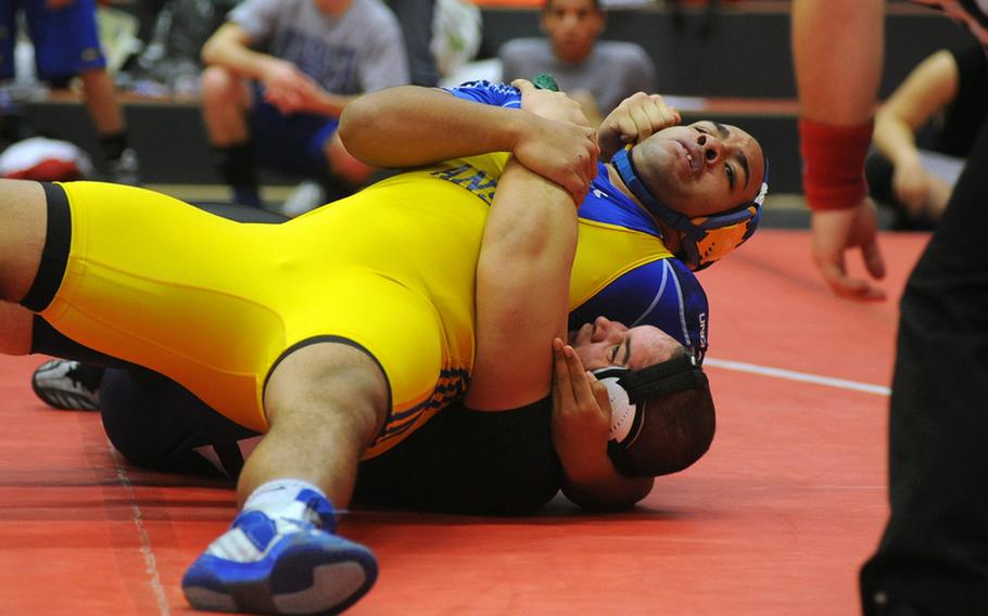 Ansbach's Raheem Beatty puts the pressure on Bitburg's Colton Engelmeier in a 285-pound match in Kaiserslautern on Saturday. Beatty won the match with a fall at 2:54.
