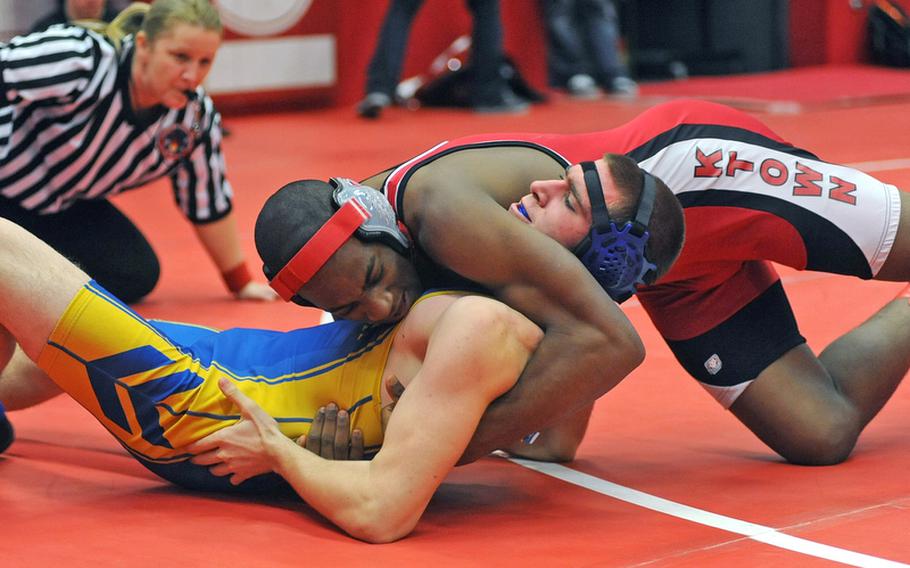 Kaiserslautern's Akir Fowlkes, top, gets the best of Ansbach's Joshua Pleake in a 170-pound match in Kaiserslautern, won by Fowlkes.
