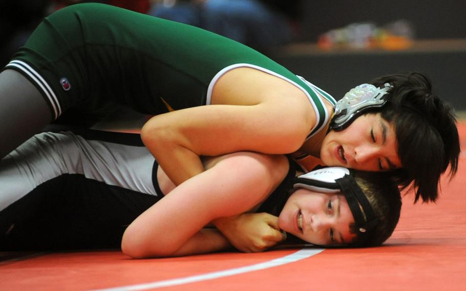 Alconbury's Nick Dufresne, top, seems to have an advantage on Bitburg's John Blake in their 160-pound match in Kaiserslautern on Saturday, but Blake turned the table and won with a 12-7 decision.