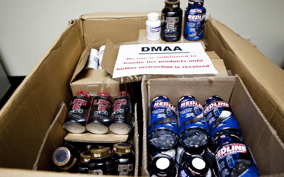 Bottles of dietary supplements containing dimethylamylamine, or DMAA, sit in boxes in the Yokota exchange store room. The Army and Air Force Exchange Service pulled the supplements from the shelves as the Defense Department investigates a possible link between DMAA and the deaths of two soldiers.