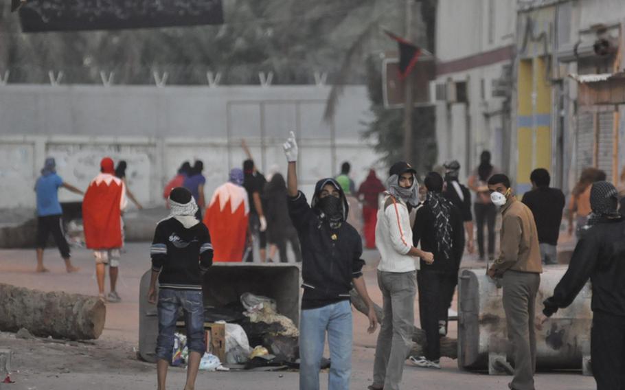 Teenage protesters prepare to engage the police Dec. 22 in Bahrain&#39;s Abu Seba village.