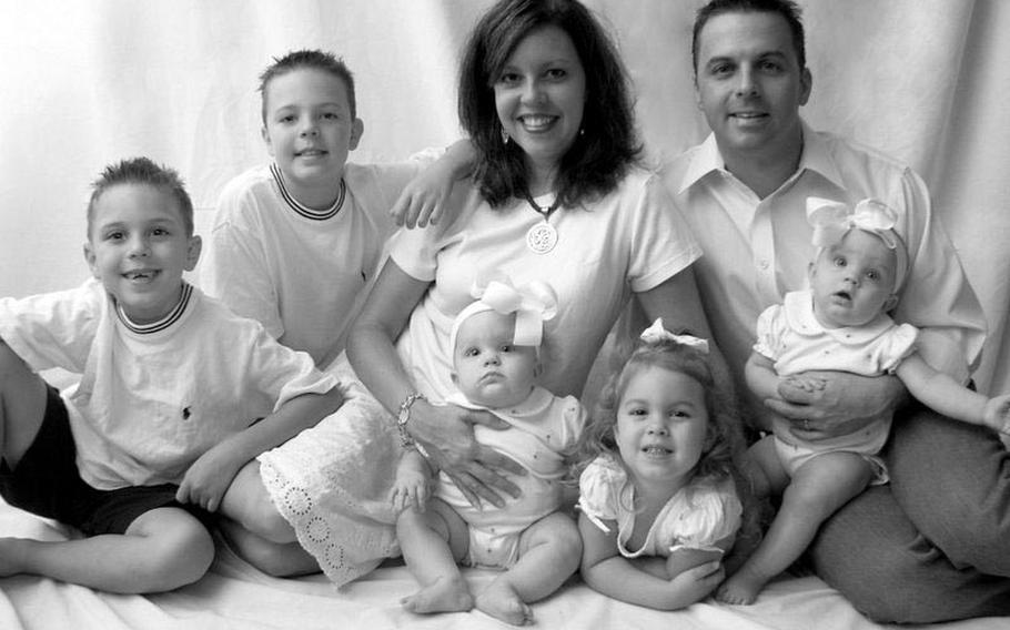 U.S. Air Force Maj. Troy Gilbert poses for a photo with his wife, Ginger, and, left to right, sons Greyson and Boston, and daughters Aspen, Isabella and Annalise. The photo was taken in 2006, about a week before Gilbert deployed to Iraq. Later that year, Gilbert, a pilot, was killed when his F-16 crashed in support of coalition troops under attack north of Baghdad. His body was never recovered.