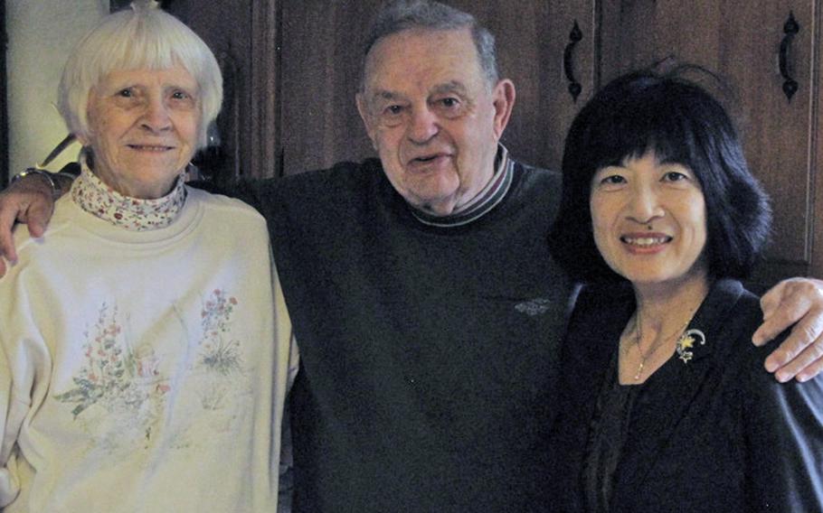 Naoko Tomioka, right, poses with Vic and Georgia Voegelin during one of her visits to the World War II veteran's home in upstate New York.