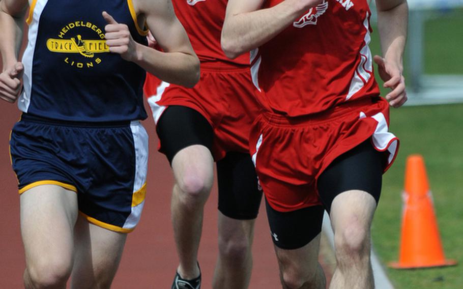 Heidelberg's Brian Hannum, left, won the boys' 1,600-meter event in Ramstein on Saturday in 4 minutes, 40.12 seconds, finishing ahead of Kaiserslautern's Michael Lawson, right, and Matthew Finley, center.