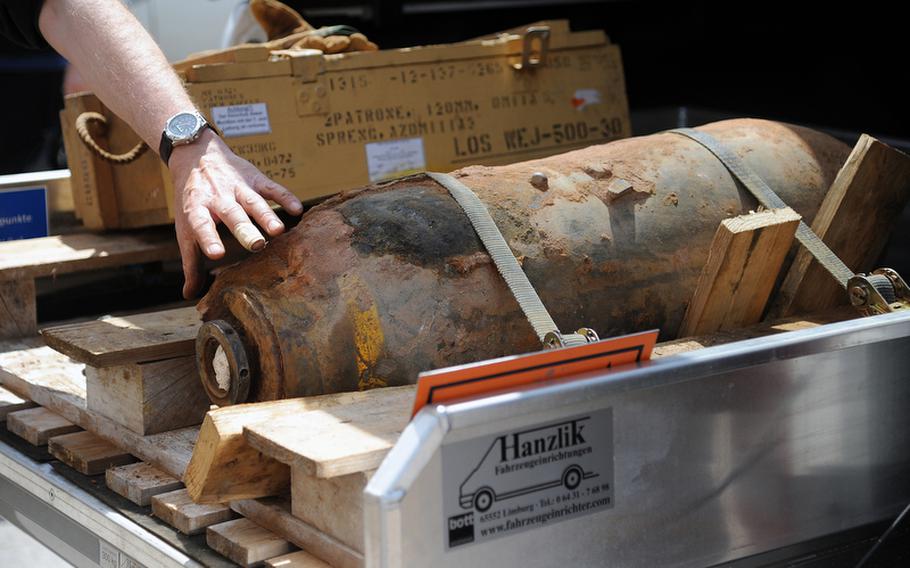 The 250-pound American World War II-era bomb that was unearthed at a downtown Kaiserslautern construction site earlier this week lies on the back of a truck after it was defused Thursday. About 3,500 residents were evacuated from a zone that extended about 330 yards around the site for nearly four hours.