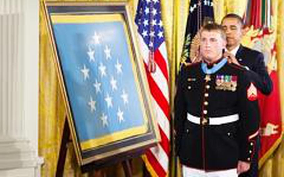 President Barack Obama awards Sgt. Dakota Meyer the Medal of Honor Sept. 15, 2011. Meyer is the first living Marine recipient of the Medal of Honor for actions in Iraq or Afghanistan. He and his family and friends were gathered at the White House to commemorate his selfless service.