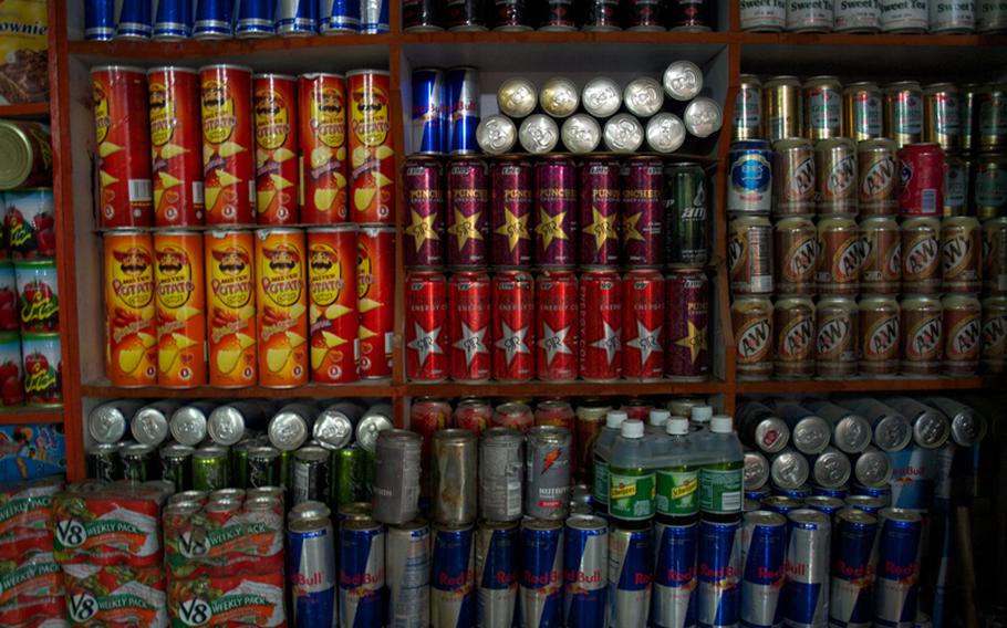 Energy drinks and snacks apparently stolen from NATO supply convoys fill the shelves at Kabul’s “Bush Market,” a warren of more than 100 shops specializing in goods apparently stolen from American supply convoys.