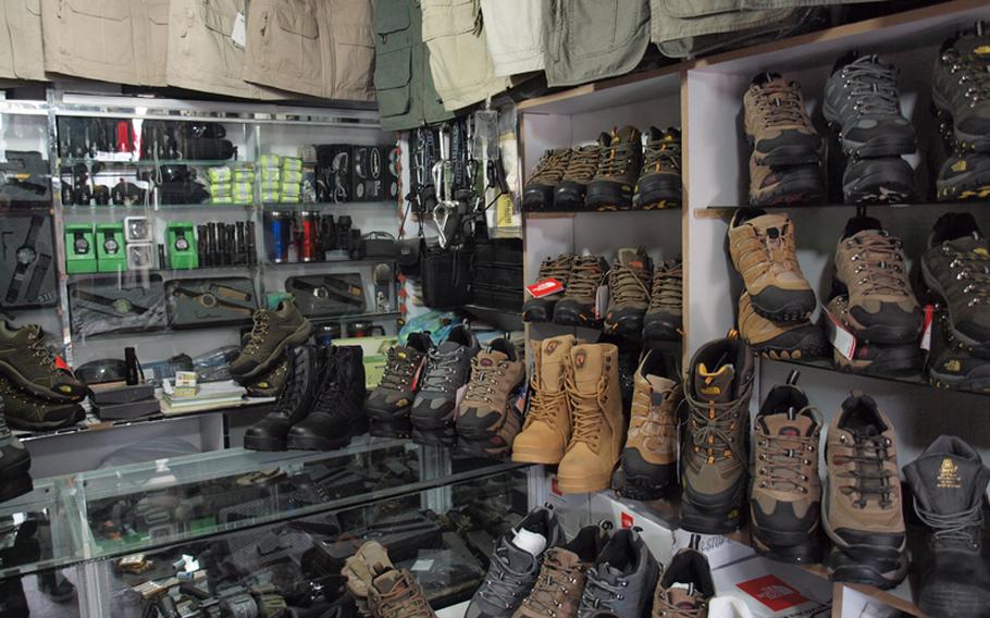 Clothing, watches, flashlights and boots of the same brand and model sold at various coalition exchange stores fill a shop in Kabul’s “Bush Market,” which specializes in goods apparently stolen from military supply convoys.