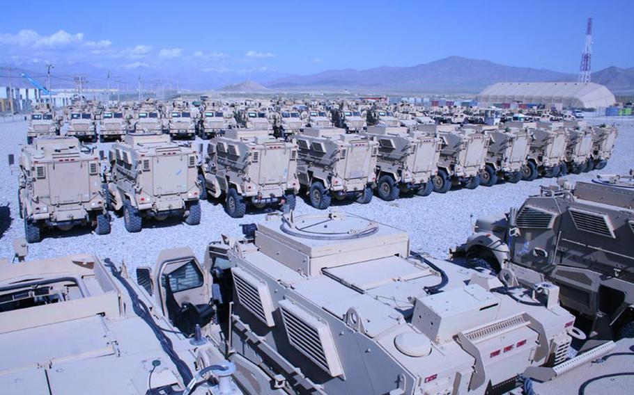 Acres of Mine-Resistant Ambush-Protected vehicles at Bagram Air Field, Afghanistan, await airlift out of the country. Such "retrograde" cargo volume is expected to build as the Afghan war drawdown commences.