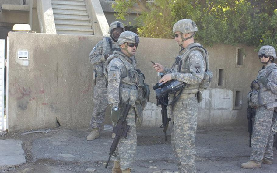 Staff Sgt. Jeremy Todd, center right, is shown while deployed to Iraq in 2008.