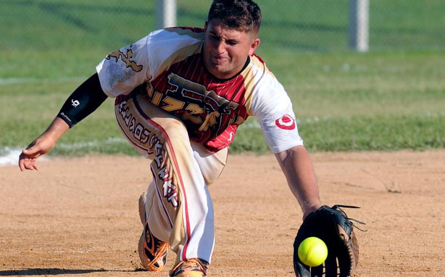 Pizza Inn third baseman Brandon Ihlen fields a Sasebo Naval Base ground ball during Sunday's knockout game in the Pacific Firecracker Softball Tournament at Camp Foster, Okinawa. Sasebo eliminated Pizza Inn 20-7.