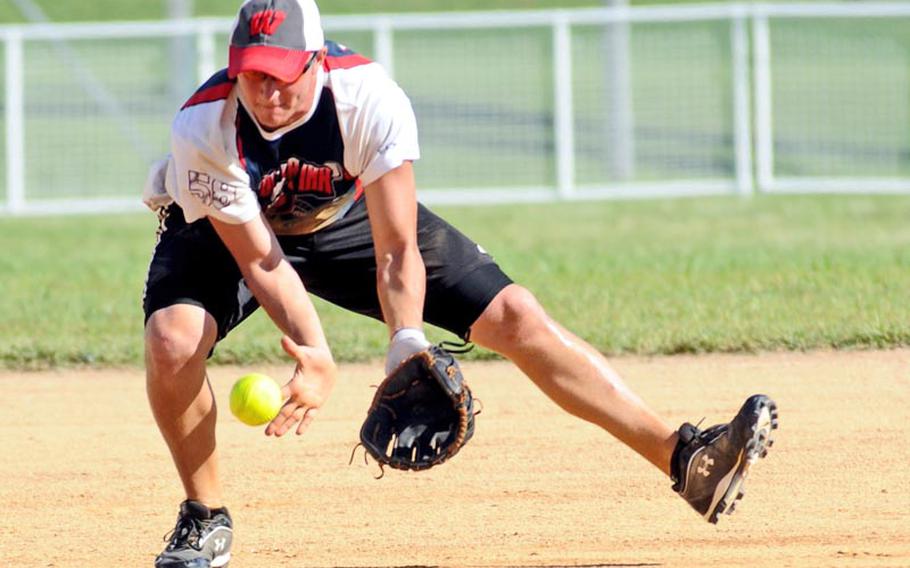 Monster Ink shortstop Joshua Schmitt fields a Misawa Air Base ground ball during Sunday's knockout game in the Pacific Firecracker Softball Tournament at Camp Foster, Okinawa. Monster Ink eliminated Misawa 11-5.