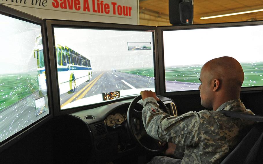 Spc. Luis Colon, of the 5th Battalion, 7th Air Defense Artillery, tests his driving skills on a drinking-and-driving simulator Wednesday at Rhine Ordnance Barracks in Kaiserslautern, Germany. The simulator was part of the ''Save a Life Tour,'' a program to give soldiers a better understanding of the consequences of driving under the influence. The soldiers could also drive a radio-controlled car while wearing goggles that simulate various degrees of intoxication. The program continues at ROB with two sessions on Thursday and Friday, at 8 a.m. and 1 p.m. both days.