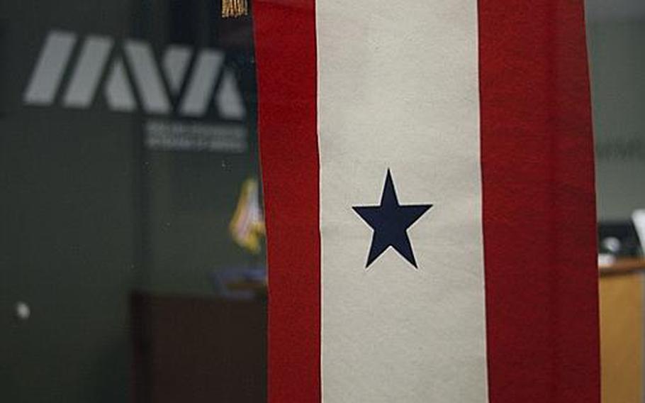A Blue Star banner hangs in the front door of the Iraq and Afghanistan veterans of America&#39;s main office in New York city.