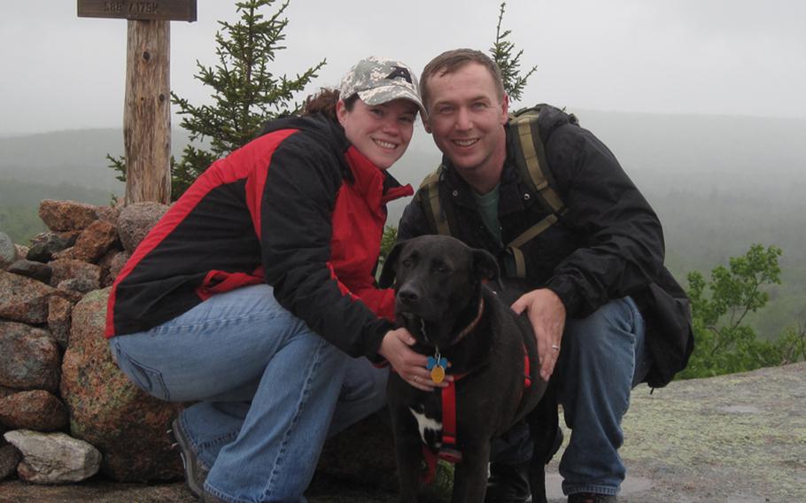 Sallie and Marc Bailey pose during a vacation in Maine in 2009. The two have been trying for three years to get pregnant, but infertility issues and Marc's Army duties have so far left them unsuccessful.