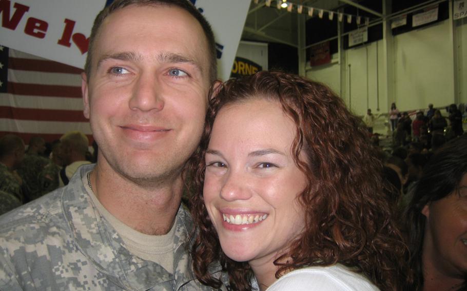Army Capt. Marc Bailey (now a major) and his wife, Sallie, smile at his unit's post-deployment welcome home ceremony in 2008. The two were married just weeks before he deployed to Iraq, and since his return have been unable to conceive a child.