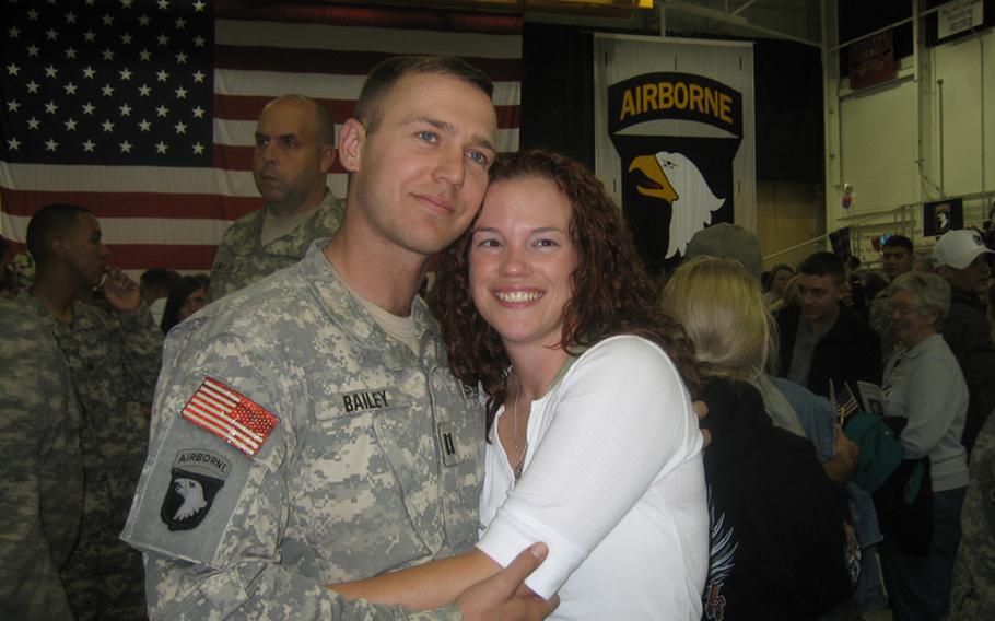 Army Capt. Marc Bailey (now a major) and his wife, Sallie, smile at his unit?s post-deployment welcome home ceremony in 2008. The two were married just weeks before he deployed to Iraq, and since his return have been unable to conceive a child.