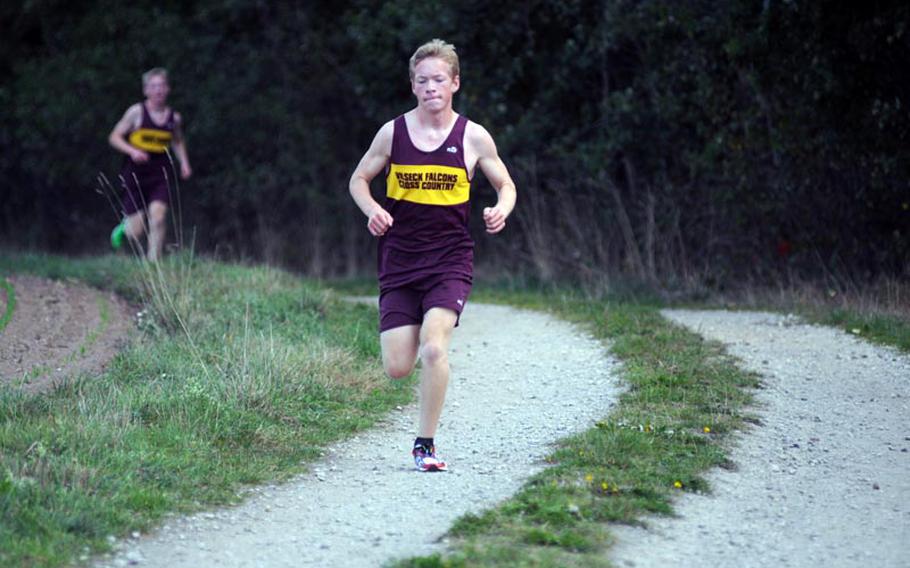 Ben Nelson leads a cross country run at Vilseck with his brother, Michael Nelson, behind him on Saturday. Ben finished first with a time of 18 minutes, 16 seconds.