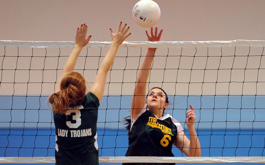 Alconbury&#39;s Hailey Sorensen knocks the ball over the net as Ankara&#39;s Aliz Soos defends in a Division III match at the DODDS-Europe volleyball championships. Alconbury won 25-15, 17-25, 25-17.