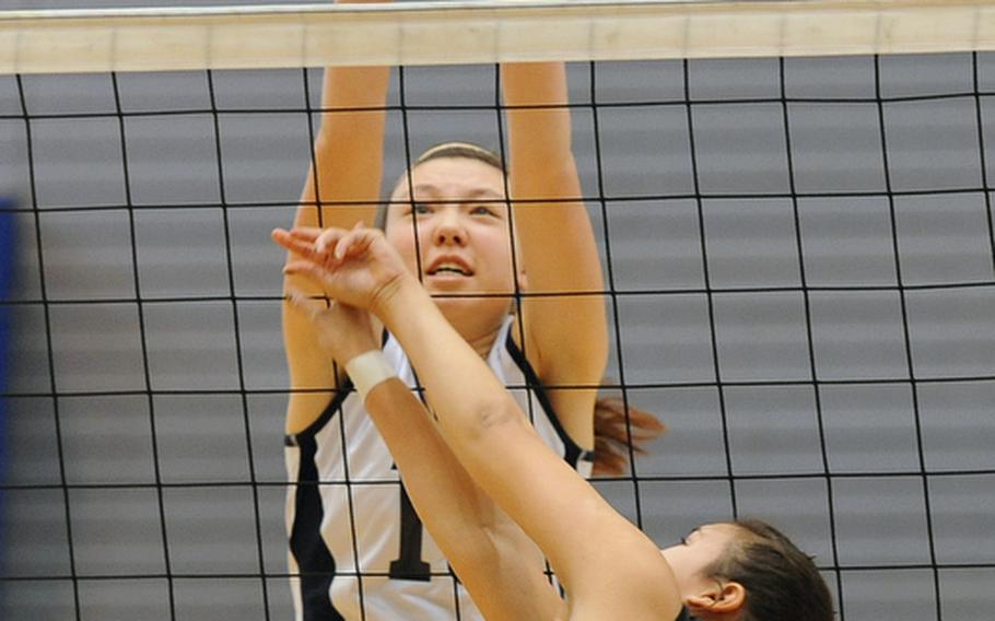 Bitburg's Michelle Morrison stretches as she tries to block a shot by Vicenza's Lorena Somera. Bitburg won the Division II match at the DODDS-Europe volleyball championships 25-23, 25-14.